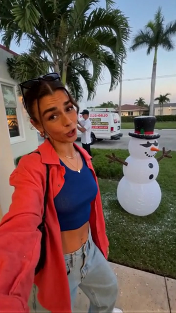 Miami snowman moment with palm-trunk lighting — film thumbnail